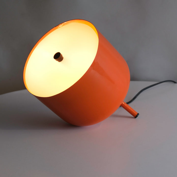 this space-saving lamp adds a pop of color and style  orange lamp console table