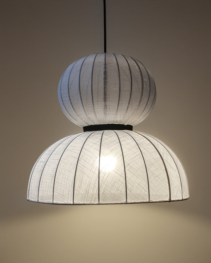White fabric lampshade crafted from premium cotton linen, enhancing interior aesthetics.