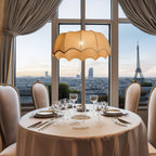 A stylish pendant light featuring a scalloped beige fabric shade, creating a warm and inviting ambiance