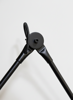 Adjustable wall lamp that pivots and extends, offering flexible lighting for reading or ambient use.