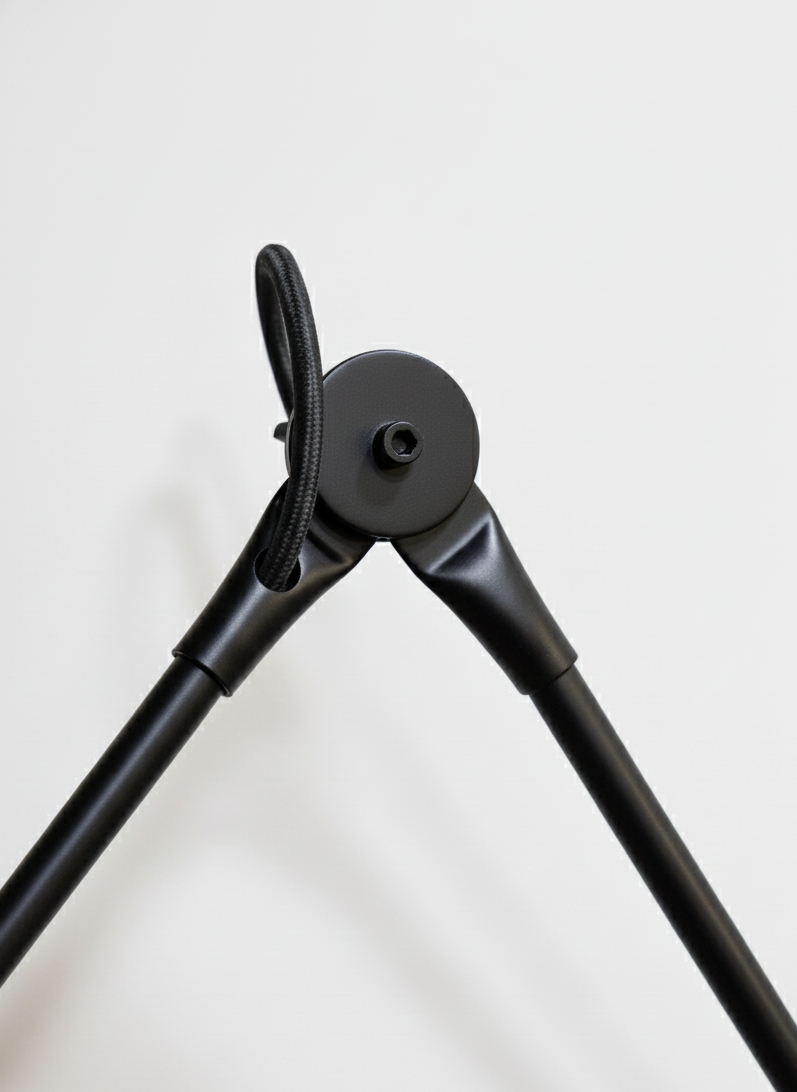 Adjustable wall lamp that pivots and extends, offering flexible lighting for reading or ambient use.