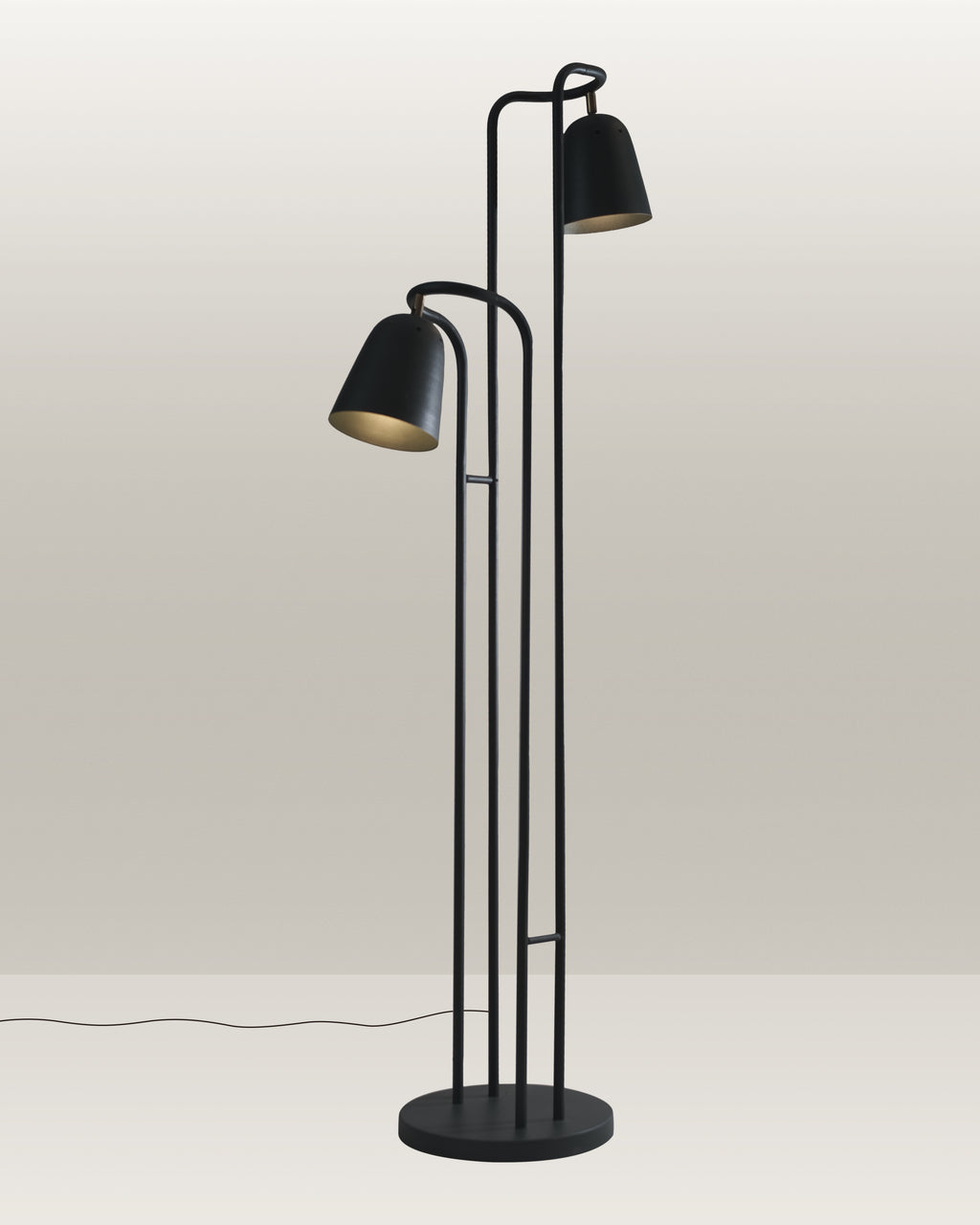 Black floor lamp with a streamlined silhouette and adjustable heads for directed illumination.