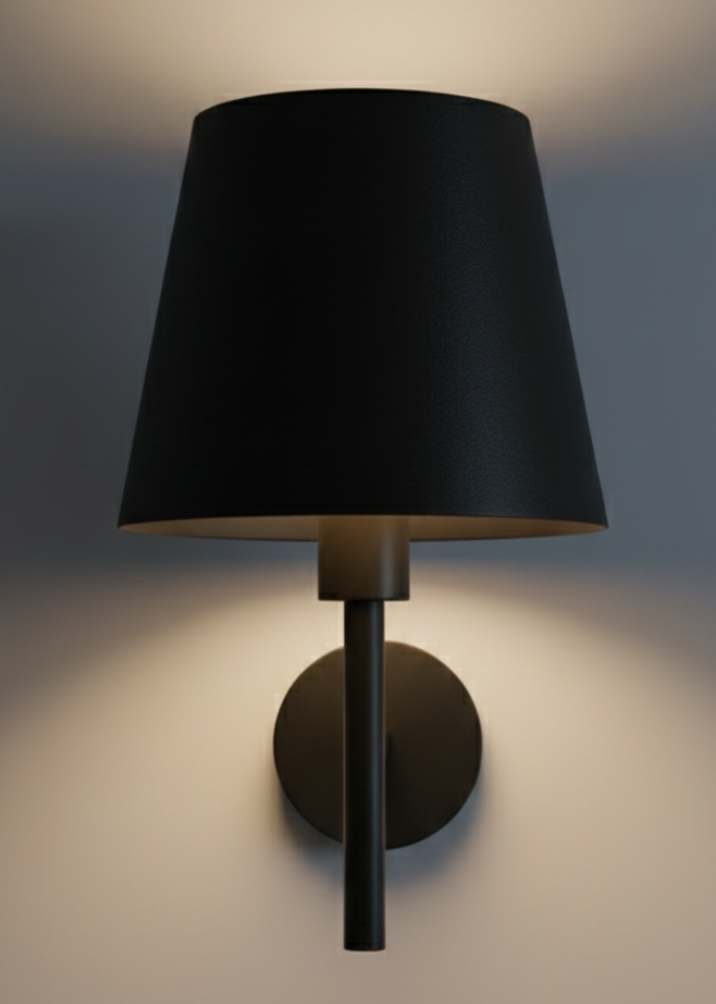 Black wall lamp with a shade on a neutral background