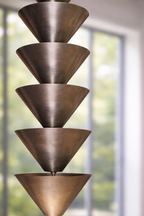 Bronze pendant light fixture with a modern interior background