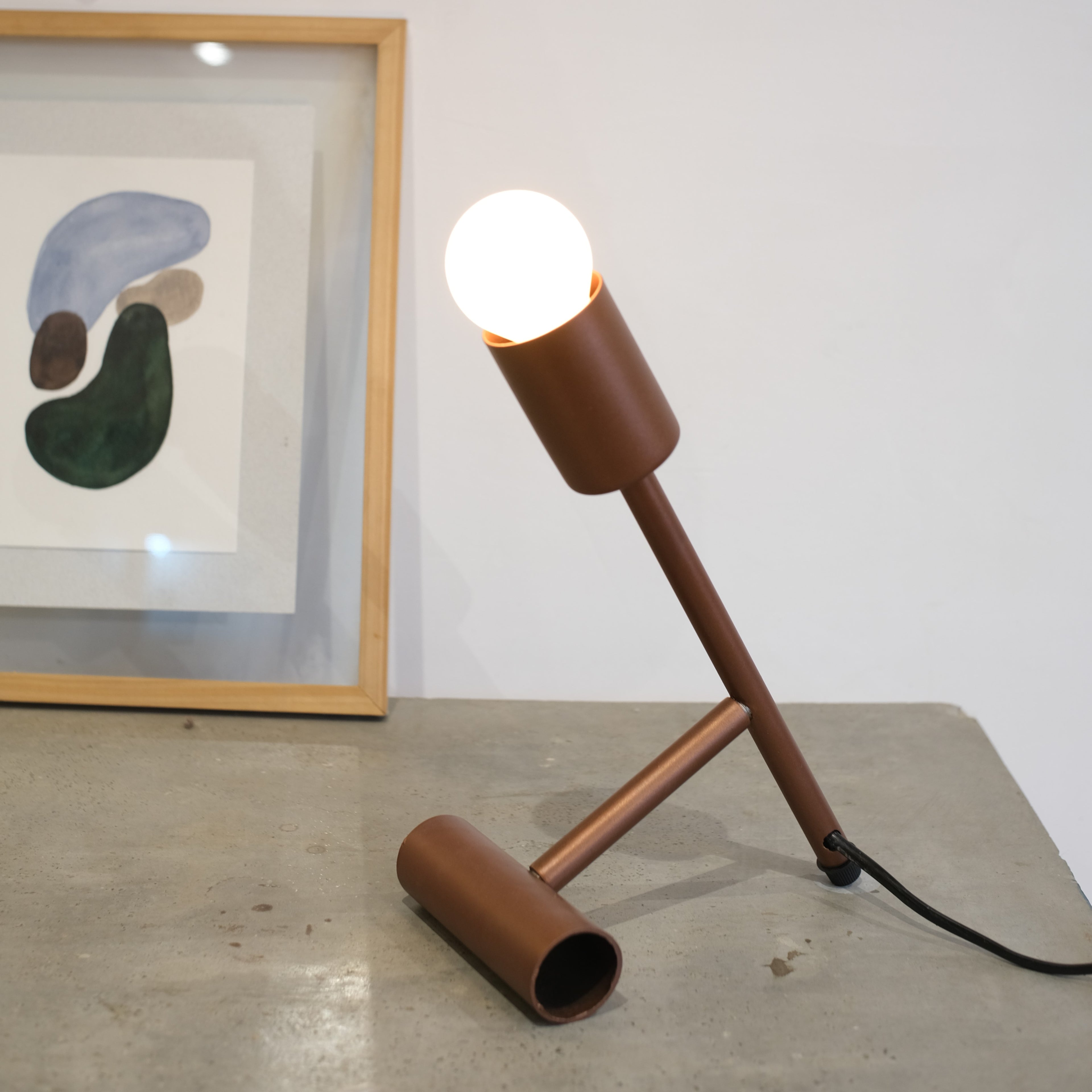 sleek sophistication of our Bronze Glow Adjustable Table Lamp