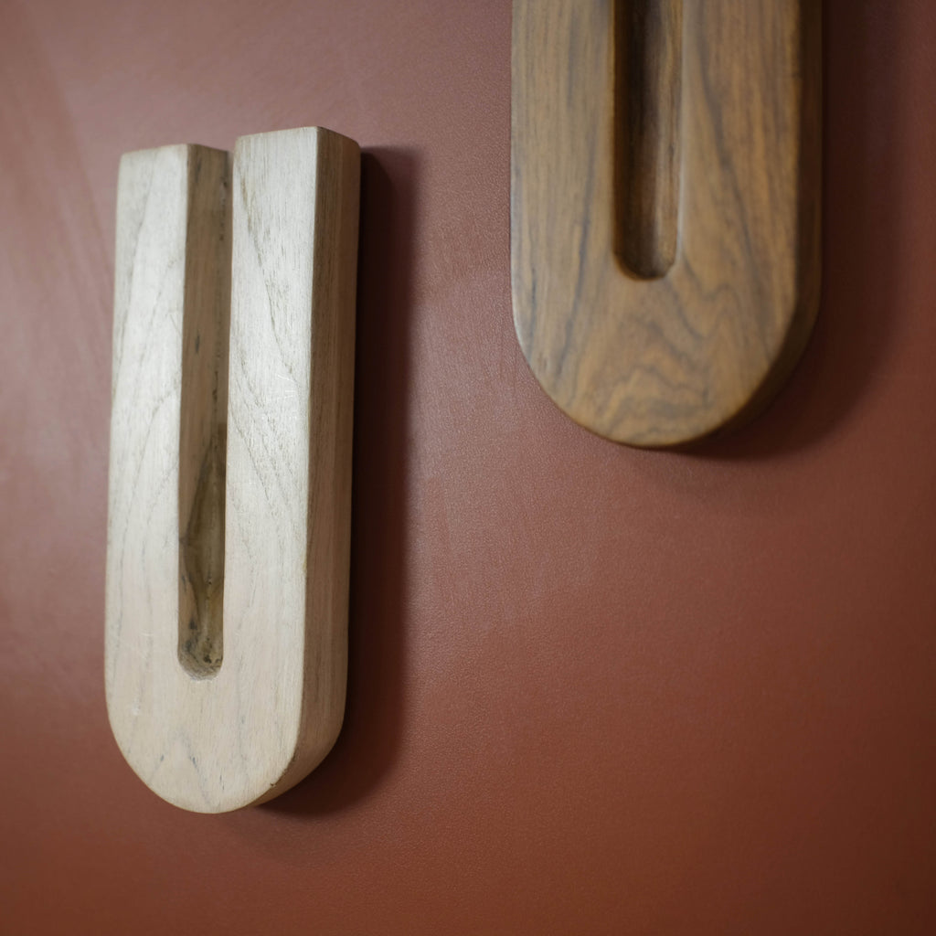 Elegant U-shaped wooden pieces with a sleek design, ideal for modern and classic interiors