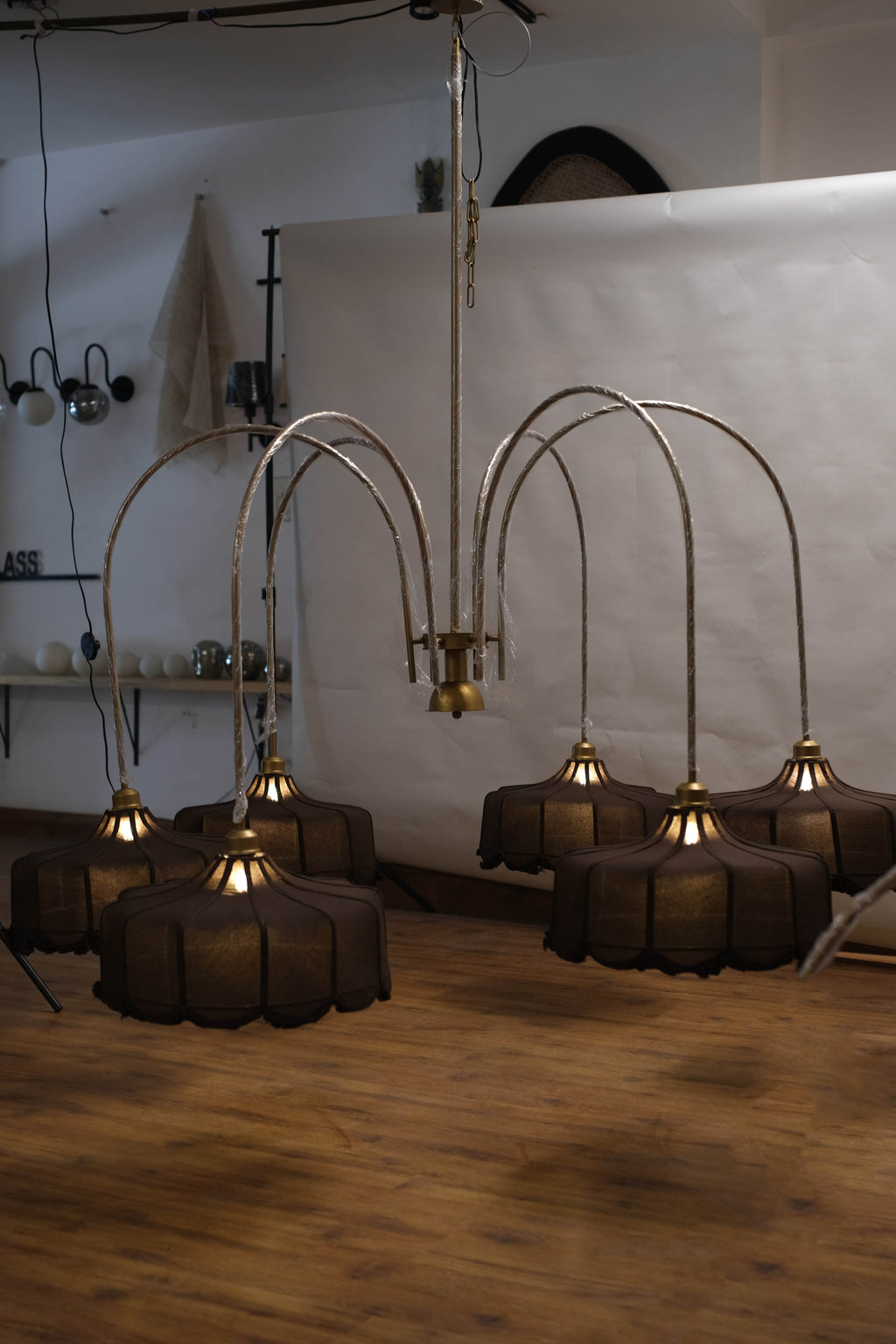 Grand chandelier with cascading crystal accents, creating a dramatic focal point in a large living room.