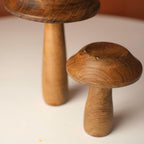 Handcrafted wooden mushrooms adding a nature-inspired aesthetic to any space.