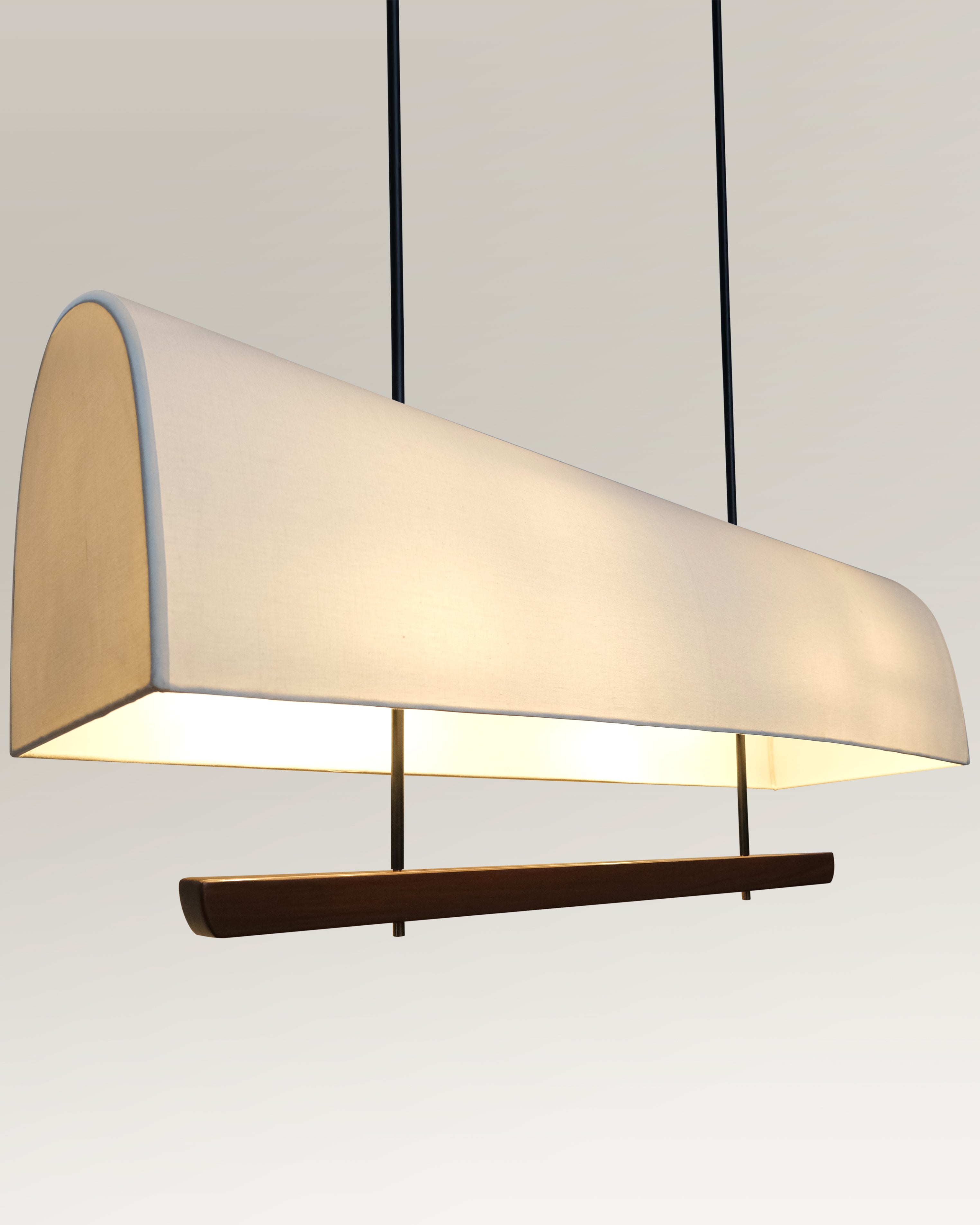 Industrial chic pendant light featuring a natural wood element and minimalist design."