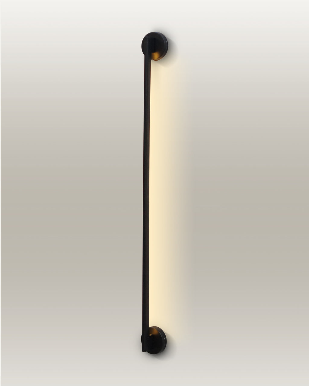 Minimalist LED linear wall lamp with a slender design and warm glow, enhancing a modern room's ambiance