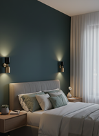 Modern bedroom with a dark green wall, gray bed, and decorative elements.