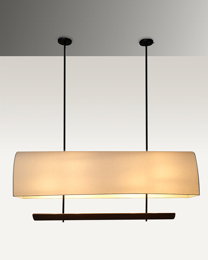 Sleek and modern industrial luxe pendant dining light with a rectangular fabric shade