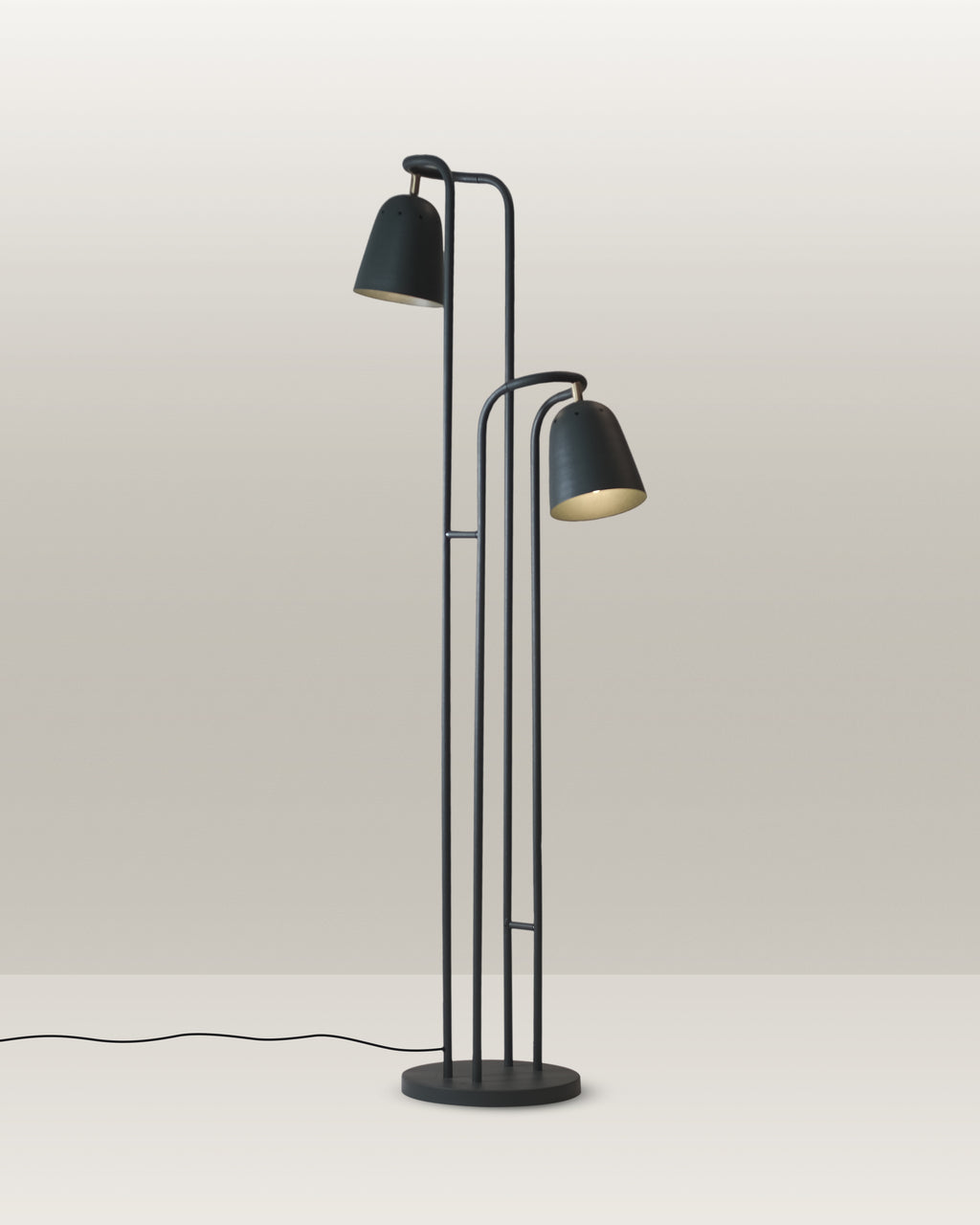 Sleek black floor lamp with two adjustable heads, perfect for modern luxury homes.