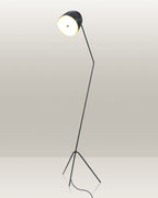 Stylish floor lamp with a tripod base and an adjustable head for directed illumination.