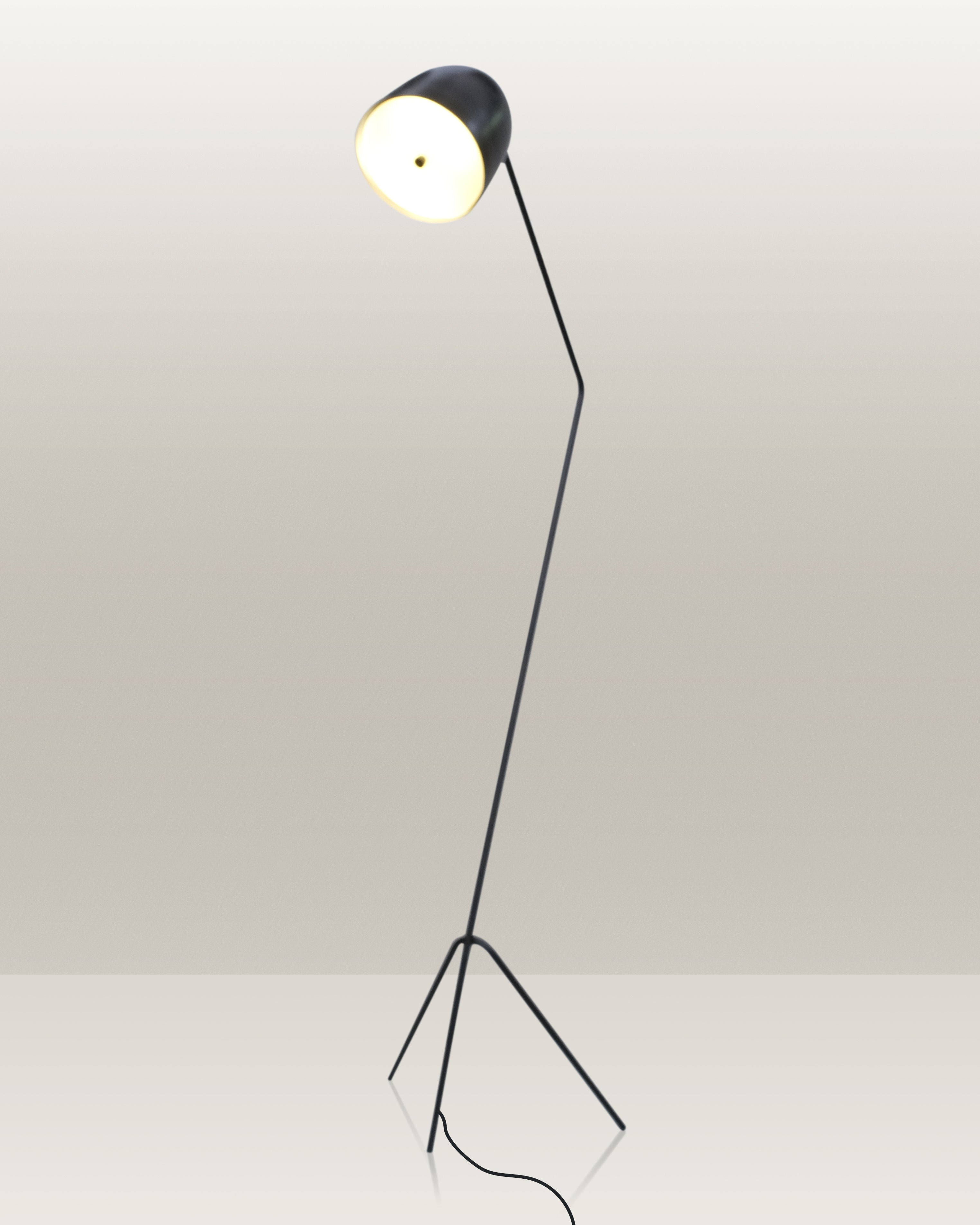 Stylish floor lamp with a tripod base and an adjustable head for directed illumination.