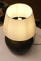 Stylish lamp with a minimalist design, textured sand base, and soft, ambient lighting for versatile use
