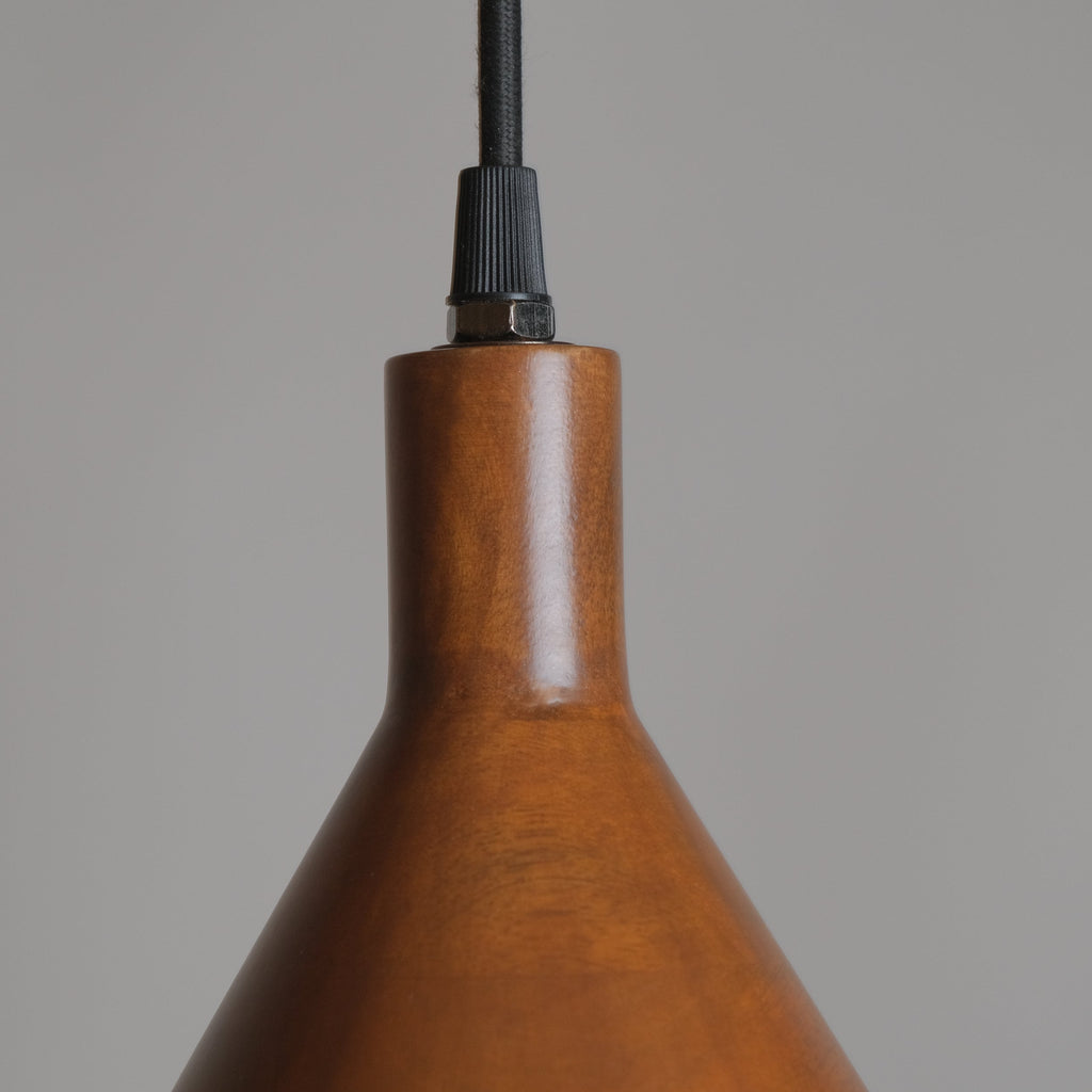 Wooden pendant light with a plain background
