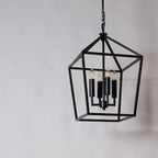 A close-up of the meticulously designed metal frame of the pendant, showcasing its intricate craftsmanship and elegant details.