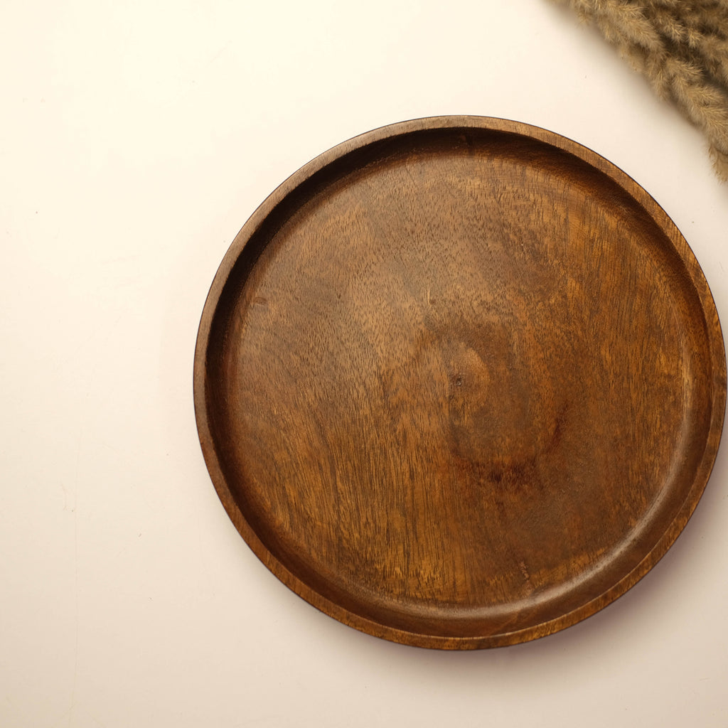 An industrial-chic tabletop setup with matte black accessories, vintage-inspired decor, and warm-toned lighting for a bold, sophisticated look.